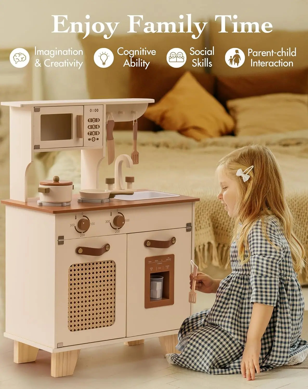 Child playing with a toy kitchen set in a living room.
