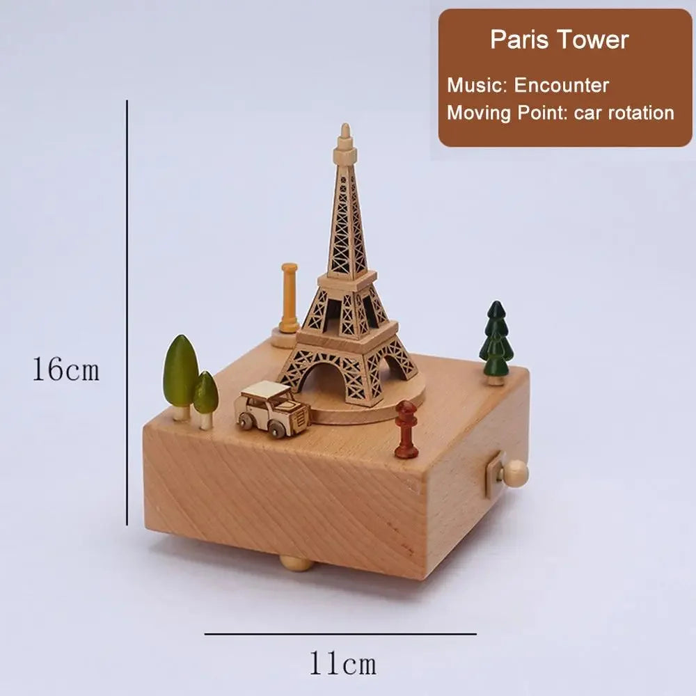 Wooden music box with Eiffel Tower design, size measurement, and feature details on a light purple background.| Oliver & Company Montessori Toys