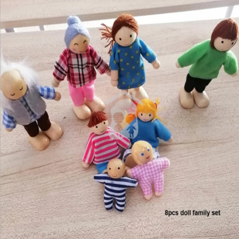 Set of eight wooden dolls in various outfits on a light surface.