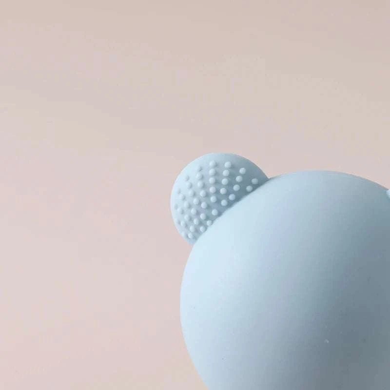 Baby Bear Silicone Teether Toy with a cartoon bear design, soothing teething discomfort and doubling as a maracas toy for sensory engagement.