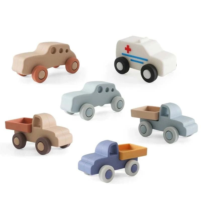 Baby Silicone Car Toys for infants, featuring soft, graspable designs ideal for sensory exploration and motor skill development, shown as part of a Montessori-inspired play set.