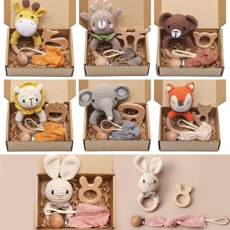 Baby's 1st Crochet Rattle Gift Set featuring various adorable crochet animal rattles with wooden handles, ideal for enhancing sensory exploration and motor skills in infants.
