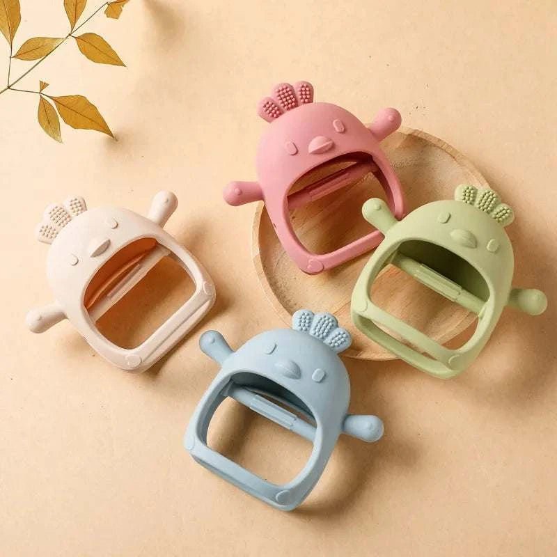 Baby's Handheld Character Teether Glove featuring a white plastic toy design, perfect for soothing infants' gums during teething.