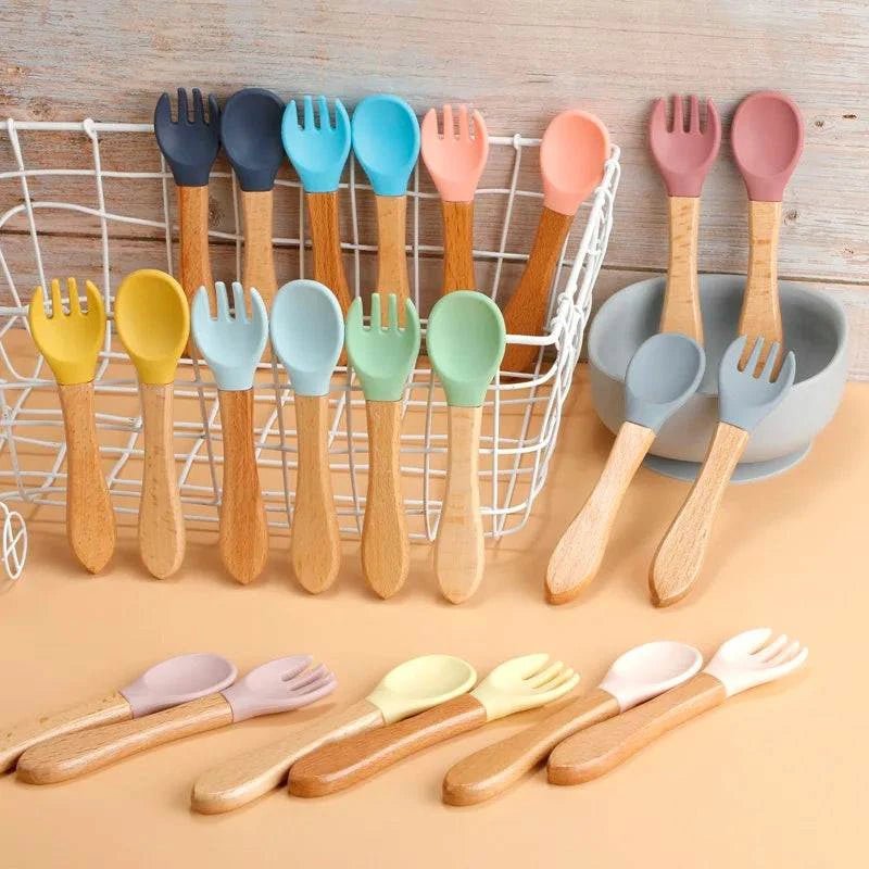 Bamboo Handled Silicone Baby Spoon & Fork Set featuring natural bamboo handles and soft silicone heads, designed for safe, eco-friendly baby feeding.