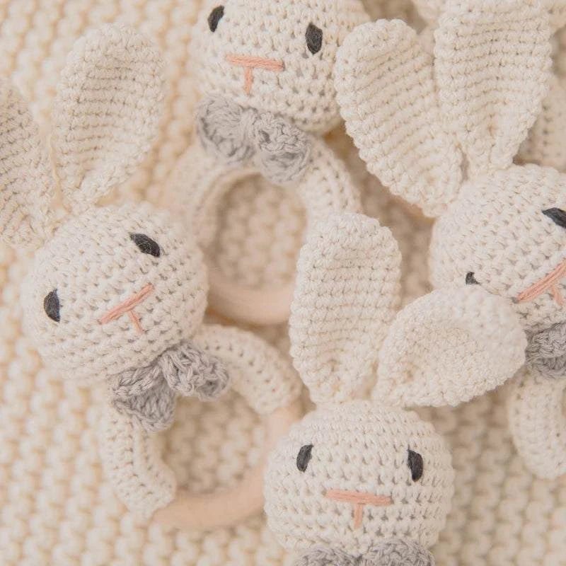 Bunny Woodland Crochet Rattle, a handcrafted toy with soft crochet detailing and wooden elements, designed for sensory development and auditory stimulation in infants.