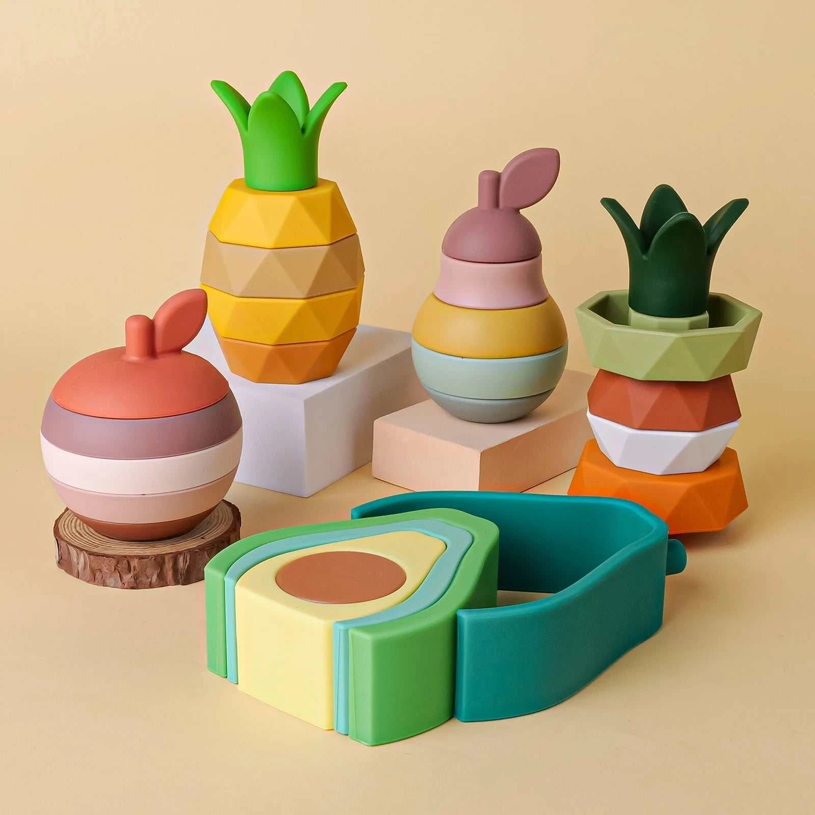 Fruit Nesting Stacking Building Blocks, soft silicone for babies, feature a fruit-themed design to enhance creativity and motor skills through stacking and building. Safe, BPA-free toy.