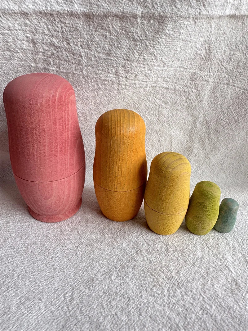 Montessori Beech Wood Rainbow Stacking Dolls, showcasing wooden nesting collectibles designed for imaginative play and learning through size exploration and fine motor skills development.