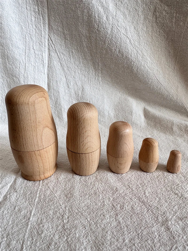 Montessori Beech Wood Rainbow Stacking Dolls: Nesting collectibles made of polished beech wood, ideal for learning size relationships and enhancing fine motor skills.