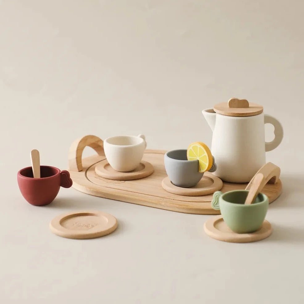 Montessori Children's Tea Set featuring wooden and silicone teacups, teapots, and spoons, designed for safe and educational playtime.
