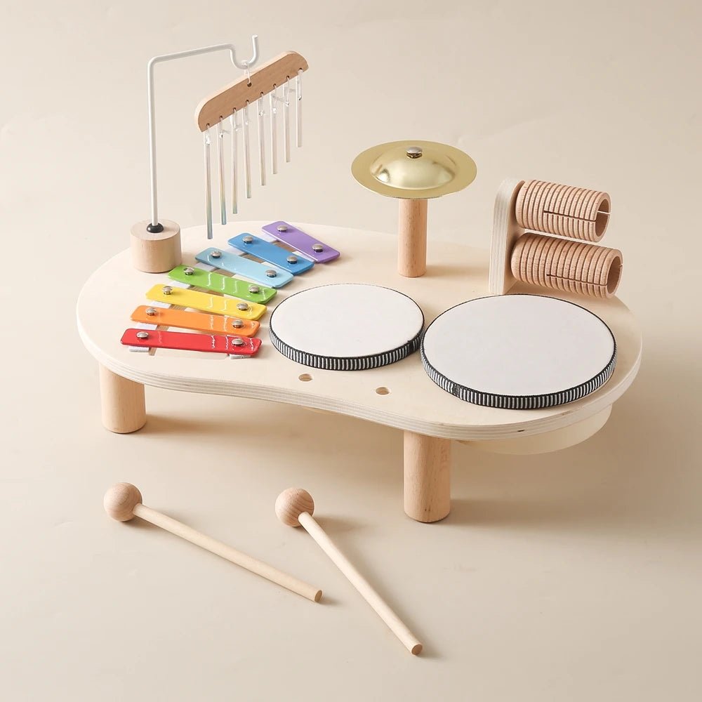 Montessori Drum Table Musical Instruments featuring a wooden drum, xylophone, and stick for children's rhythmic and creative development.
