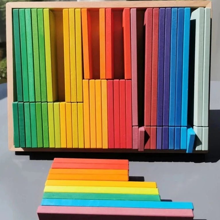 Montessori Large Stacking Slats Set featuring colorful wooden blocks, cubes, and peg dolls, ideal for creative play and educational development.
