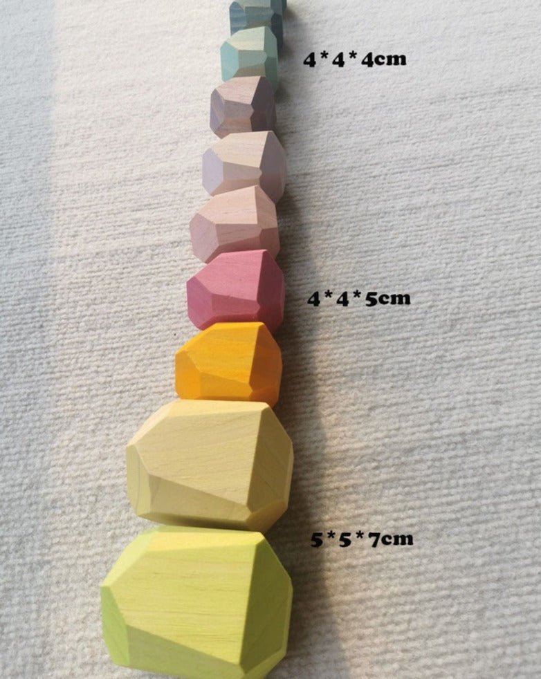 Montessori Large Wooden Balancing Stones in various sizes, crafted from beech and pine wood, designed for tactile, educational play in a Montessori setting.