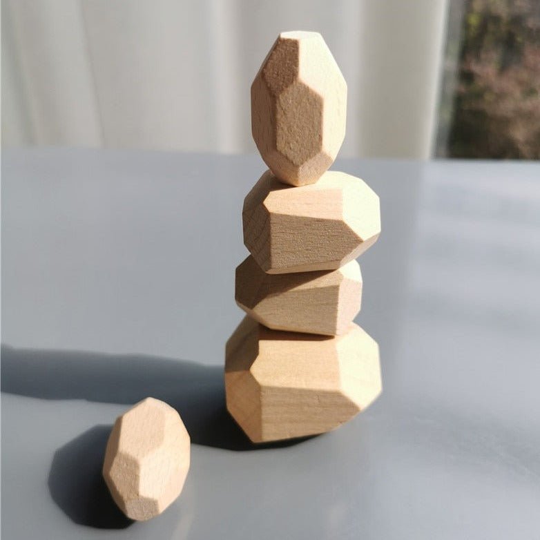 Montessori Large Wooden Balancing Stones in a stack, showcasing various sizes and smooth carved surfaces, designed for tactile and sensory play.