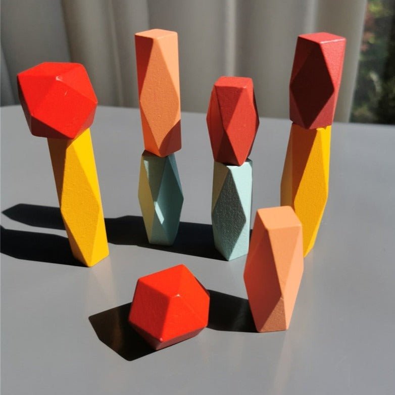 Montessori Large Wooden Balancing Stones for child-led play, featuring various sizes for stacking and enhancing balance and spatial awareness through tactile exploration.