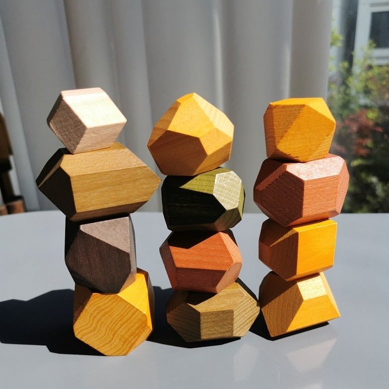 Montessori Large Wooden Balancing Stones stacked, showcasing various sizes for tactile play, promoting balance and spatial awareness in line with Montessori educational principles.