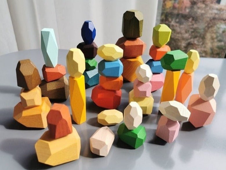 Montessori Large Wooden Balancing Stones, featuring colorful geometric shapes for stacking, encourage balance and spatial awareness through open-ended play.