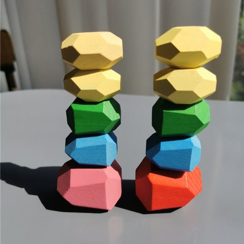 Montessori Large Wooden Balancing Stones in a stack, showcasing their varied sizes for building and stacking, encouraging balance and spatial awareness in child-led play.