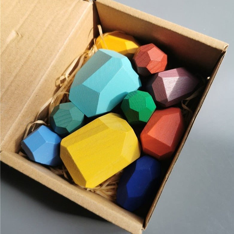 Montessori Large Wooden Balancing Stones in a box, designed for tactile play, teaching balance and spatial awareness through stacking and building.