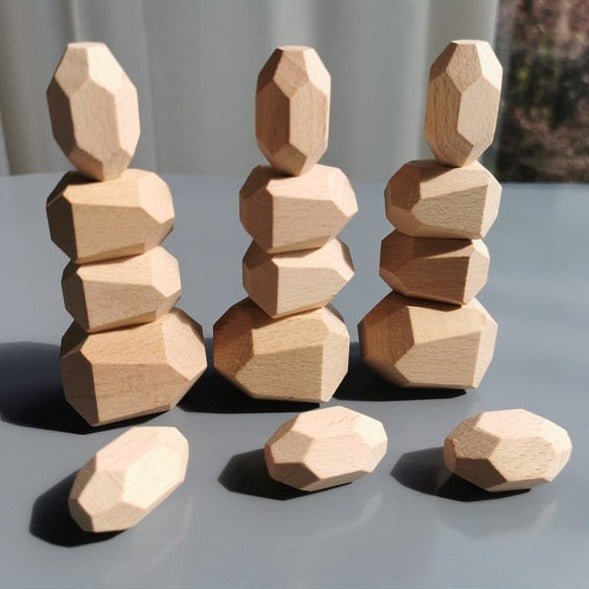 Montessori Large Wooden Balancing Stones stacked in various shapes, showcasing their tactile, educational design for promoting balance and creativity in child-led play.