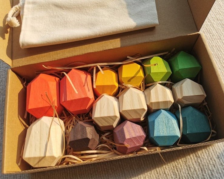 Montessori Large Wooden Balancing Stones in a box, featuring varied shapes for tactile play and learning balance and spatial awareness.