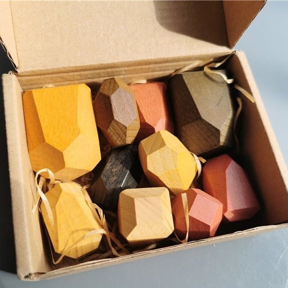 Montessori Large Wooden Balancing Stones in a box, showcasing varied shapes and sizes, designed for creative, hands-on play and learning.