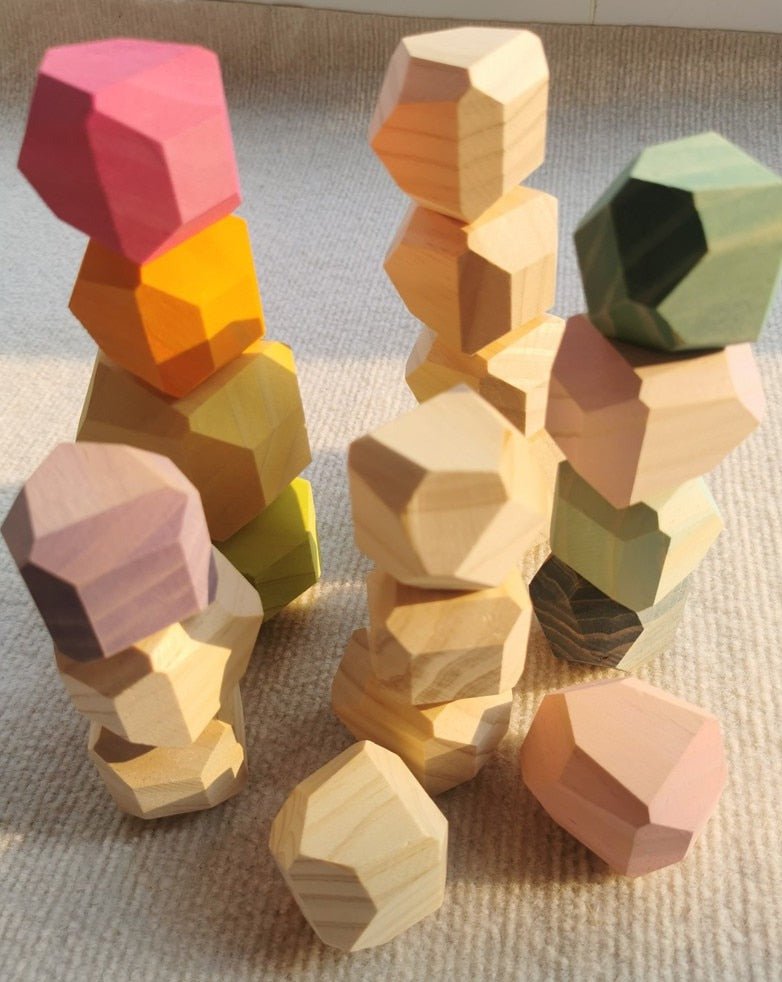 Montessori Large Wooden Balancing Stones stacked, showcasing their varied shapes and sizes for tactile, open-ended play, promoting balance and spatial awareness.