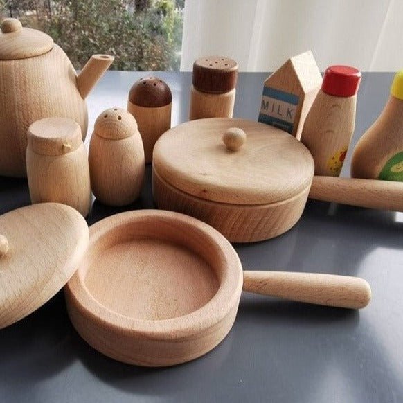 Montessori Natural Wood Kitchen Toy Set featuring wooden utensils and containers, promoting creative and educational play for children, aligned with Montessori principles.