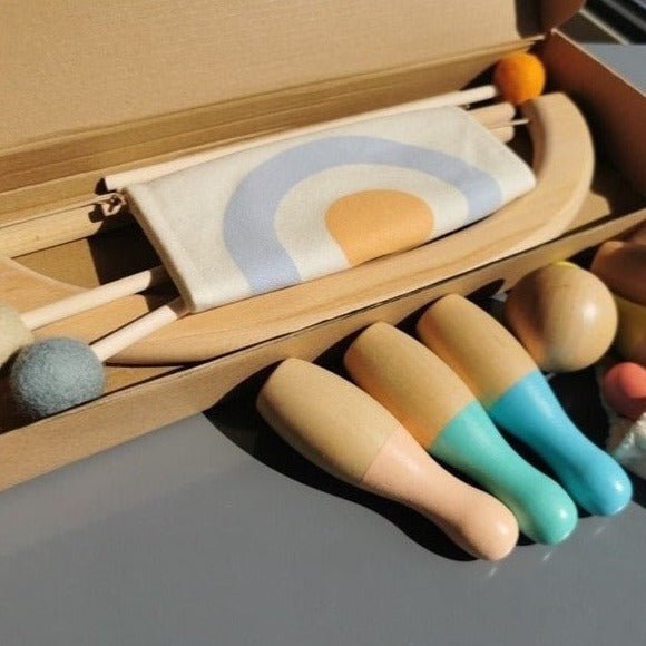 Montessori Outdoor Wooden Archery and Bowling Set featuring a box with wooden toys, including colorful bowling pins, designed for children's active play and coordination learning.