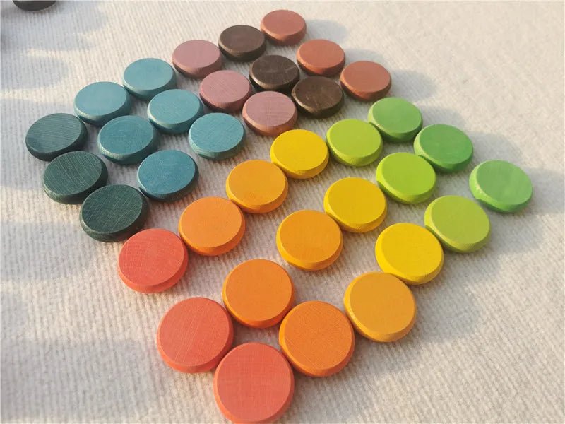 Montessori Rainbow Stacking Coins and Rings with Peg Dolls, featuring colorful circular pieces for stacking and play, enhancing fine motor skills and creativity in children.