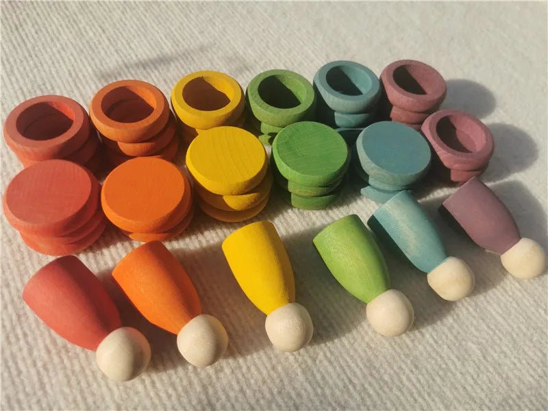 Montessori Rainbow Stacking Coins and Rings with Peg Dolls, featuring colorful wooden figures for stacking and imaginative play, enhancing motor skills and creativity.