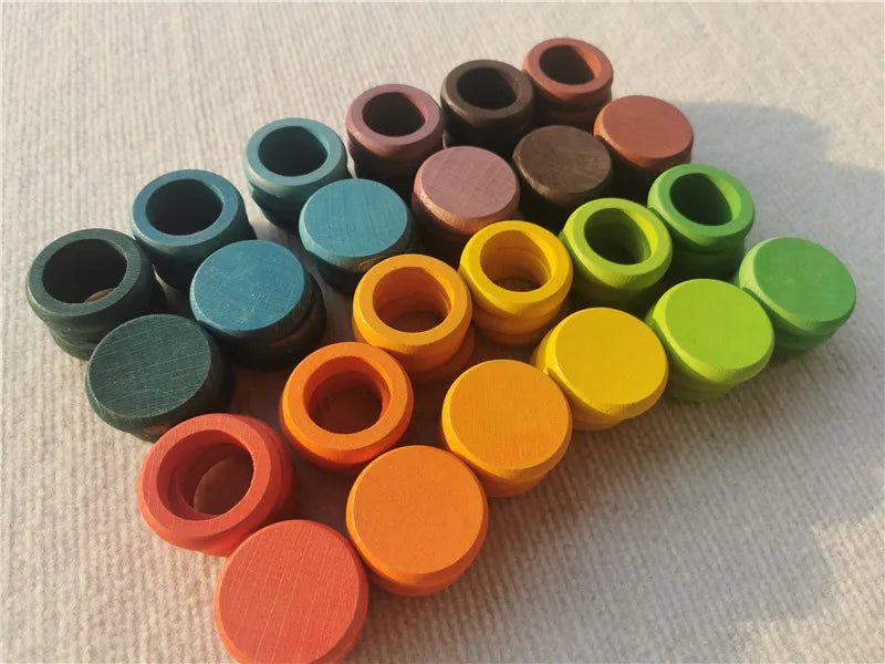 Montessori Rainbow Stacking Coins and Rings with Peg Dolls, showcasing colorful wooden toys designed for fine motor skills and imaginative play for children.