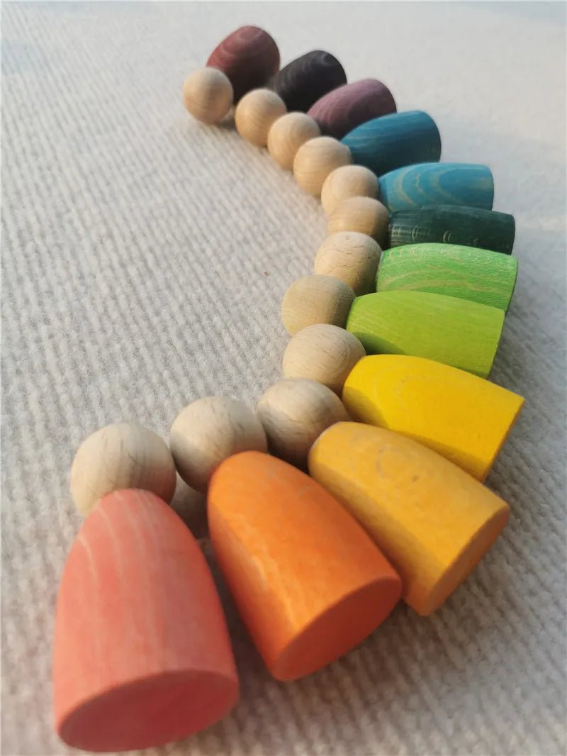 Montessori Rainbow Stacking Coins and Rings with Peg Dolls, showcasing beech wood beads, designed to enhance fine motor skills and imaginative play for children.