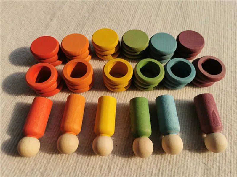 Montessori Rainbow Stacking Coins and Rings with Peg Dolls made of beech wood, featuring stackable coins, rings, and peg dolls for imaginative play and skill development.