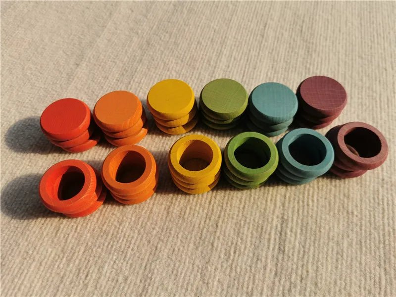 Montessori Rainbow Stacking Coins and Rings with Peg Dolls, featuring colorful wooden pieces for stacking, fine motor skill development, and imaginative play.