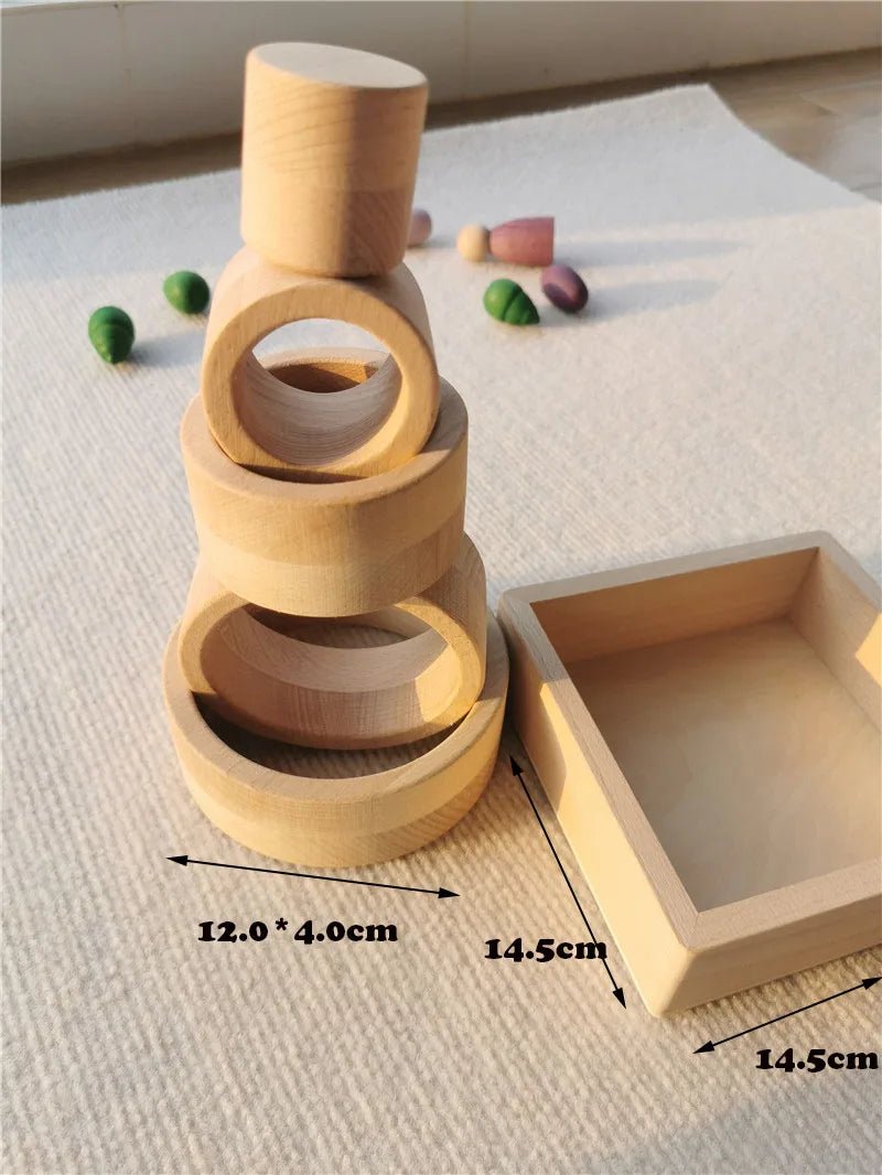 Montessori Rainbow Wooden Nesting Rings: Stacking Blocks, featuring beech wood rings designed for imaginative play and motor skill development, stacked neatly in an indoor setting.