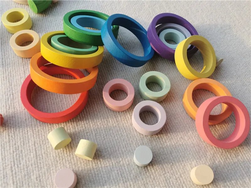 Montessori Rainbow Wooden Nesting Rings: Stacking Blocks, featuring colorful beech wood rings designed for imaginative play and skill development, displayed in a playful arrangement.