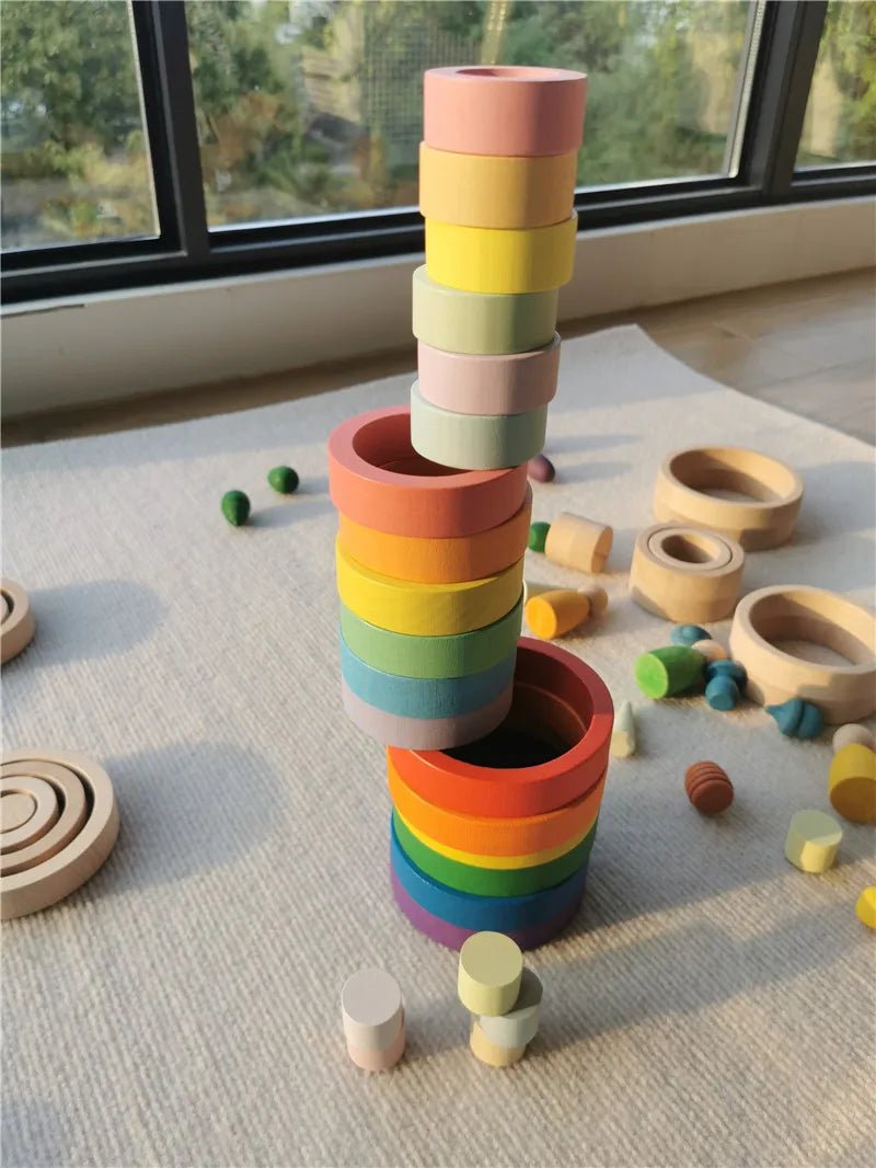 Montessori Rainbow Wooden Nesting Rings: Stacking Blocks displayed in a colorful stack, showcasing their vibrant design and educational, eco-friendly nature for imaginative play and learning.