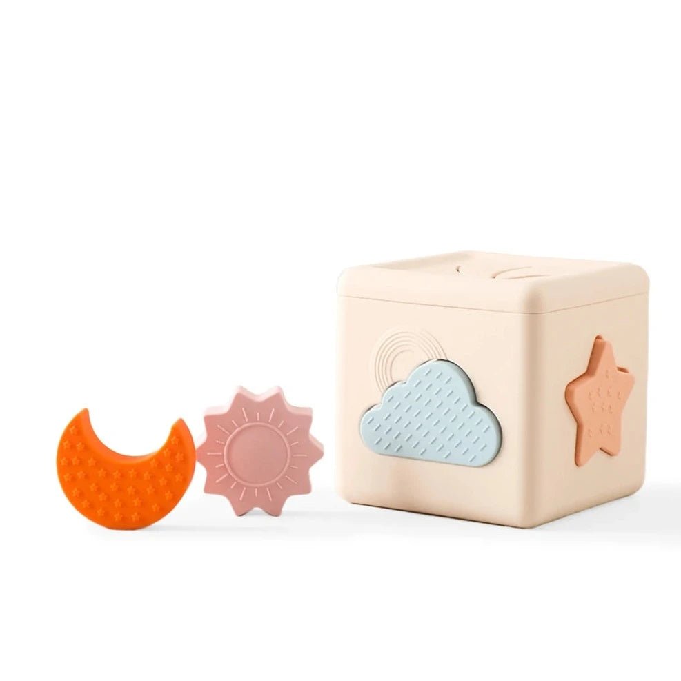 Montessori Silicone Tissue Box with interactive shapes for cognitive development, promoting hand-eye coordination and sensory exploration. Perfect for Montessori learning environments.