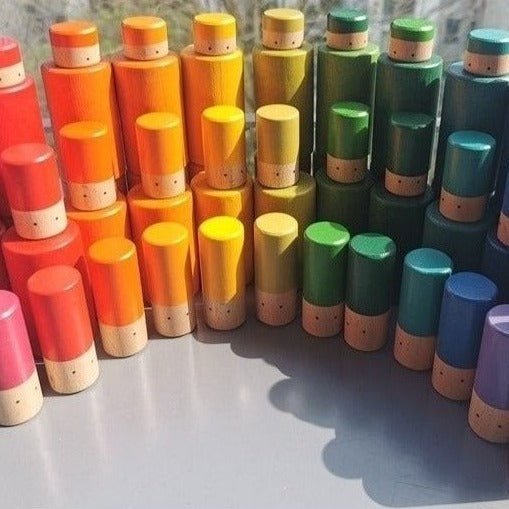 Montessori Tube Dolls Stacking Blocks Set featuring wooden peg dolls for stacking and sorting activities, enhancing fine motor skills and creativity through interactive play.