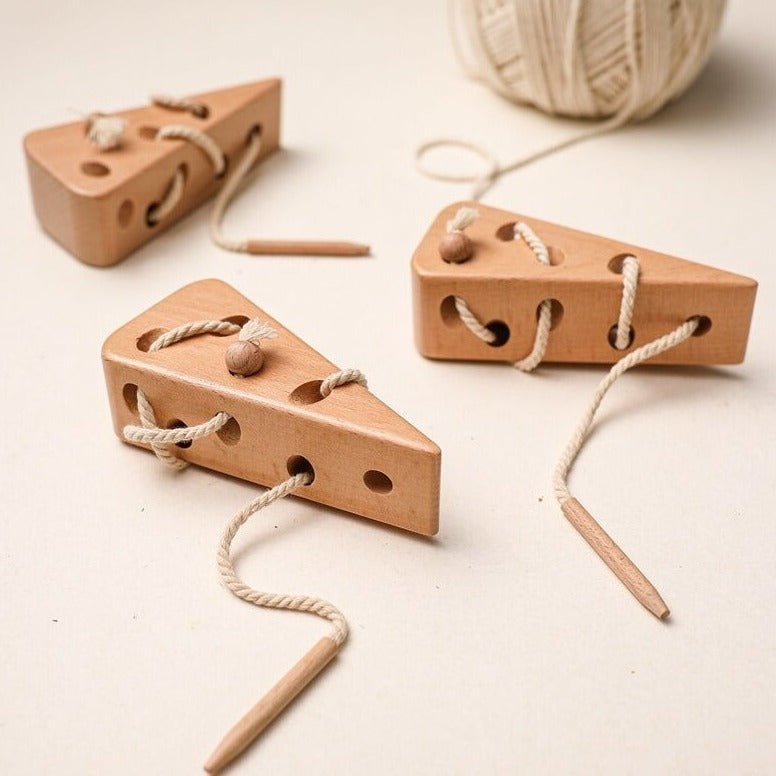 Montessori Wooden Cheese Threading Toy with holes for threading, designed to enhance motor skills and creativity in children through safe, educational play.