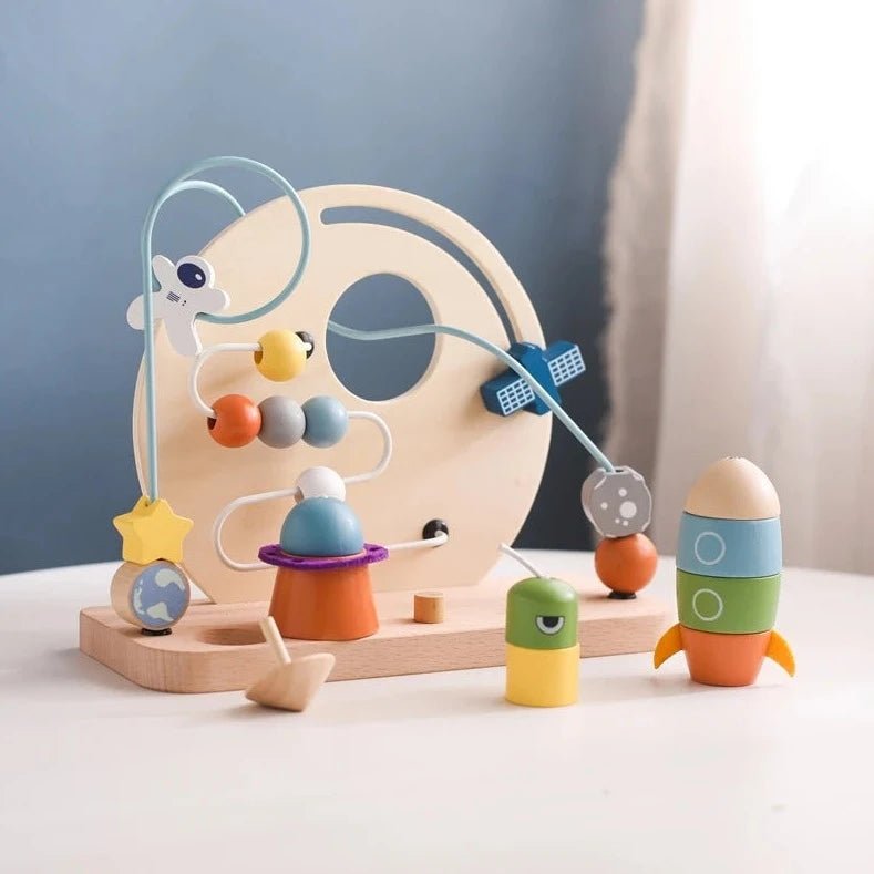 Montessori Wooden Outer Space Toy featuring planets and beads, designed to inspire imagination and develop finger grip skills through educational play.