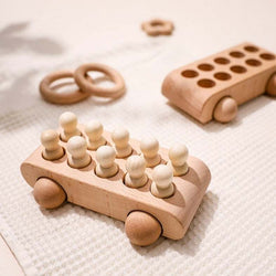 Montessori Wooden Peg Dolls Bus and Car set, featuring wooden pegs and smooth, handcrafted beech wood toys, perfect for creative and educational play for children over 3 years.