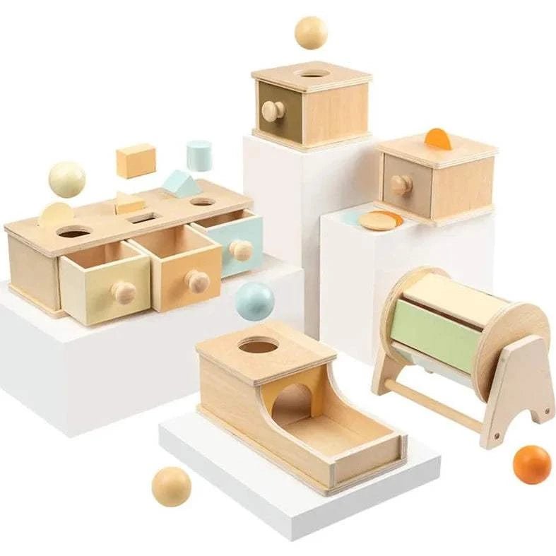 Montessori Wooden Permanence Box with a hole, designed to enhance infants' object permanence skills, featuring wooden toys for educational play.
