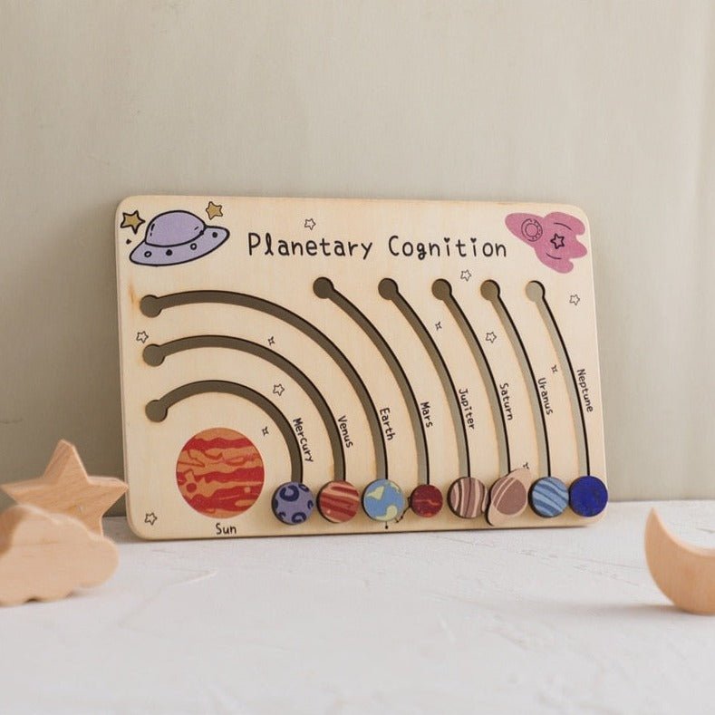 Montessori Wooden Planetary Playboard featuring movable wooden planets and stars, designed to inspire creativity and curiosity in early learning.