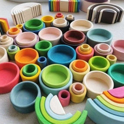 Montessori Wooden Rainbow Nesting Bowls and Arch Stacker Blocks made from basswood, designed for creative play and educational development.