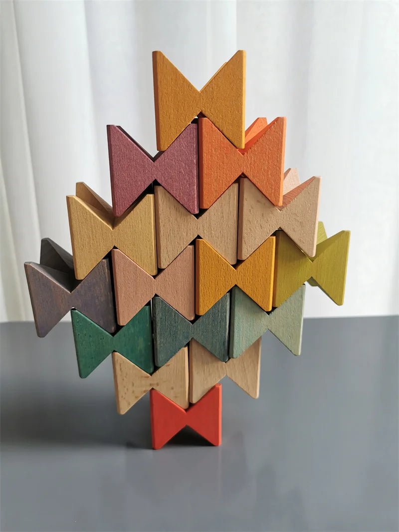 Montessori Wooden Stacking Butterfly Blocks, hand-carved from hardwood, stacked creatively in a fish shape, showcasing educational play and skill development.