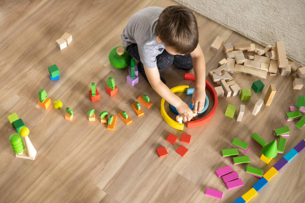Little boy playing with Montessori blocks