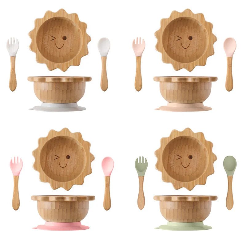 Sunny Sun Baby Wooden Tableware Set featuring a bamboo bowl with a cute face and silicone base, ideal for engaging toddler mealtime from Oliver & Company Montessori Toys.