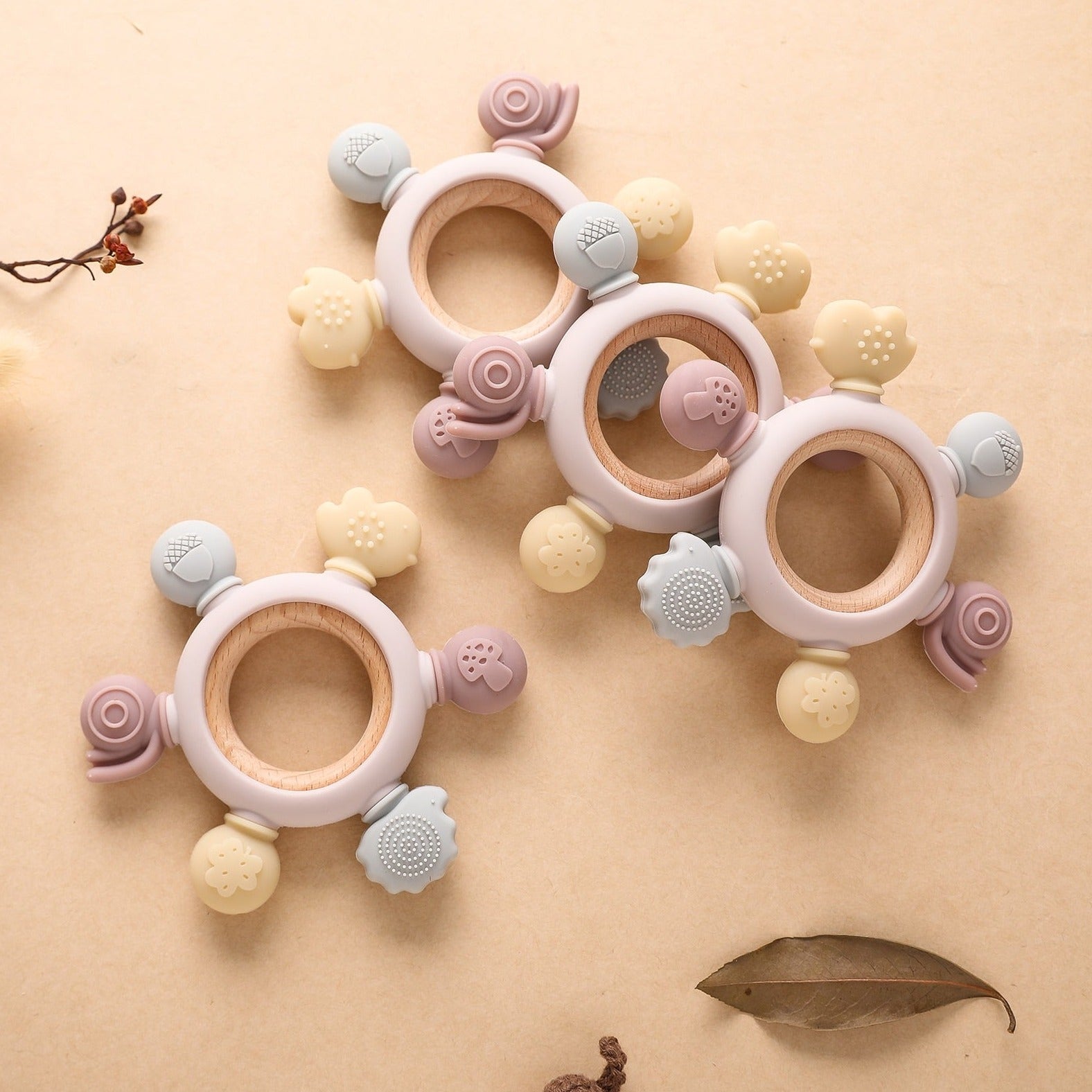 Wooden Baby Forest Teethers featuring eco-friendly rattling beads, designed to aid cognitive development during the teething stage.