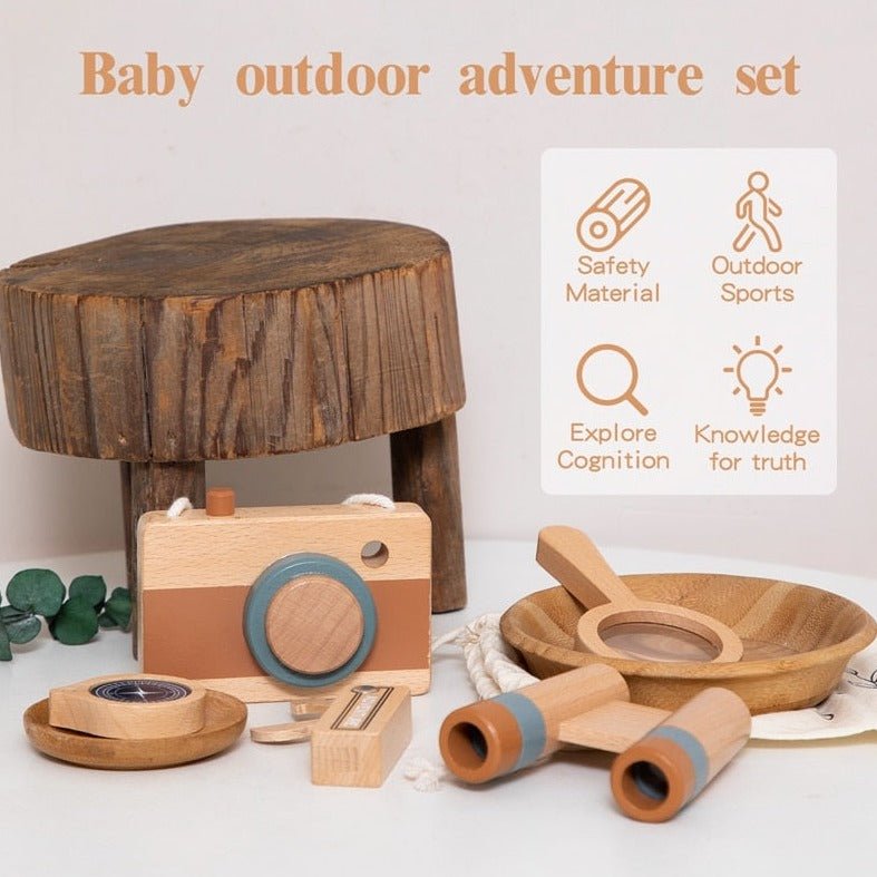 Wooden Montessori Outdoor Adventure Set featuring a toy camera, magnifying glass, and more on a table, designed for children's exploration and learning.
